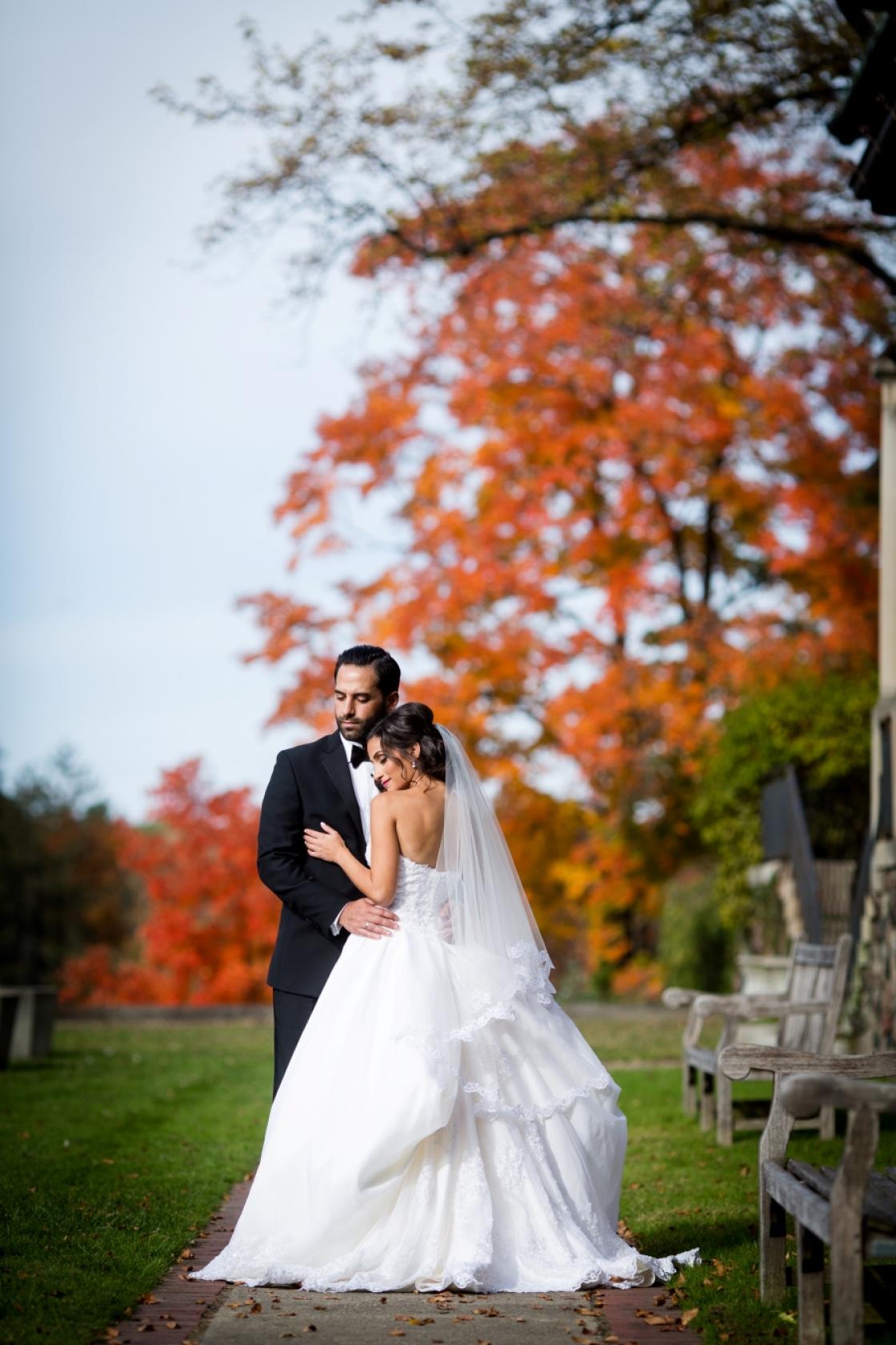 Portrait of two guests at Cranbrook Gardens in the fall. 