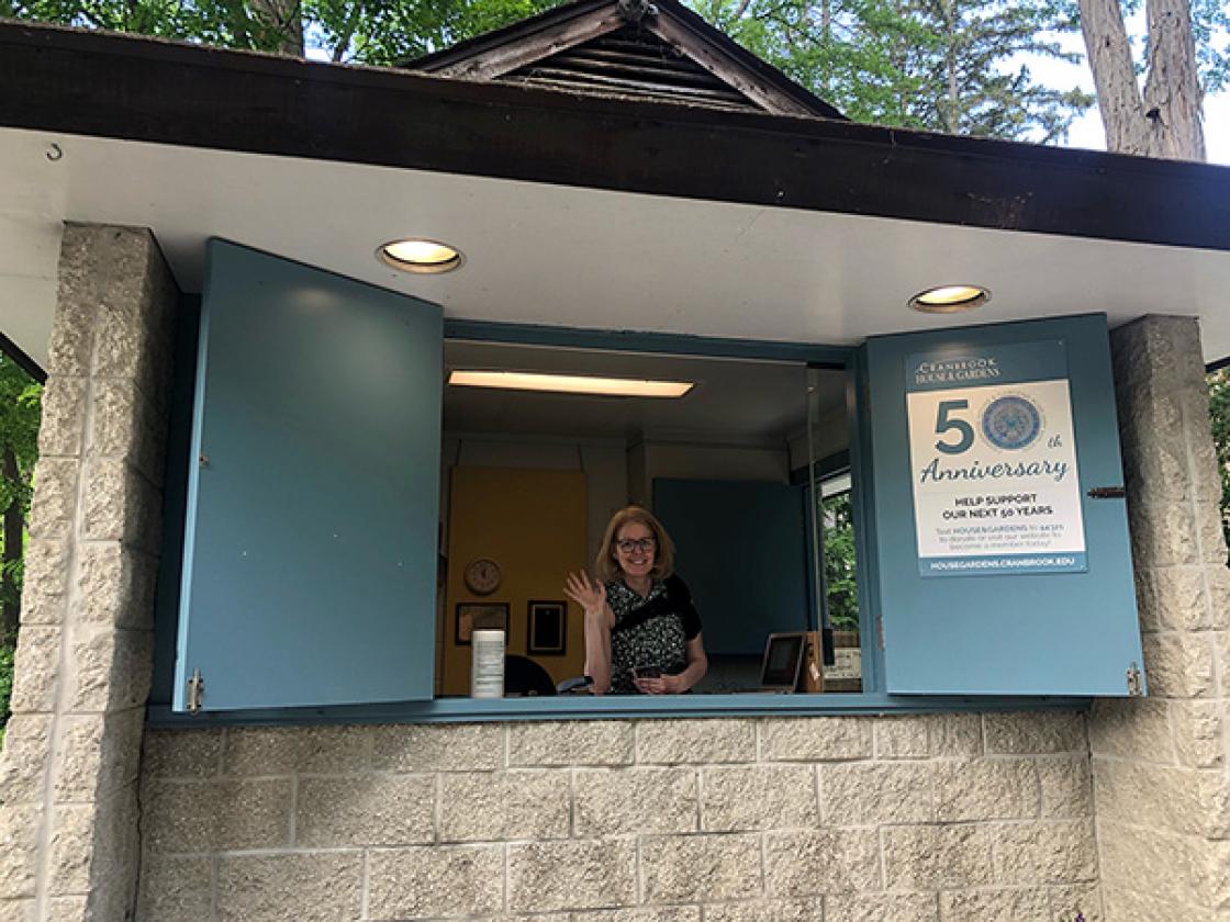 Photograph of a volunteer in the Gatehouse Welcome Center.
